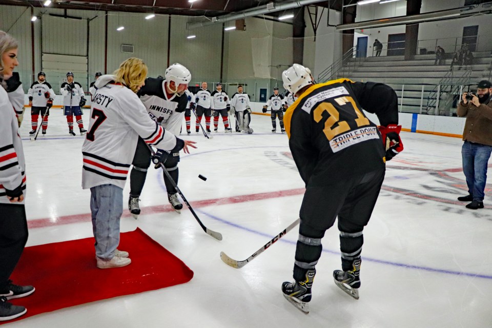 Family members of the late Tyler Haarstad were invited to do the ceremonial puck drops before the Innisfail Eagles Alumni Fundraiser Game for Haarstad's three children. An estimated $40,000 was raised. Johnnie Bachusky/MVP