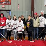 A group shot of the family of the late Tyler Haarstad, including Bailey Quirico, the mother of his three children Presley, Lennon, Jagger (white Eagles jerseys), younger brother Cody (red Eagles jersey) and parents Sherry and Everett Haarstad. Former Innisfail Eagle and emcee for the tribute Jason Lenz is at far right, with alumni representatives also included, one beside Lenz and another at far left beside Cody Haarstad. Johnnie Bachusky/MVP Staff